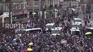 Netherlands- Scuffles erupt at banned Amsterdam demo against COVID res